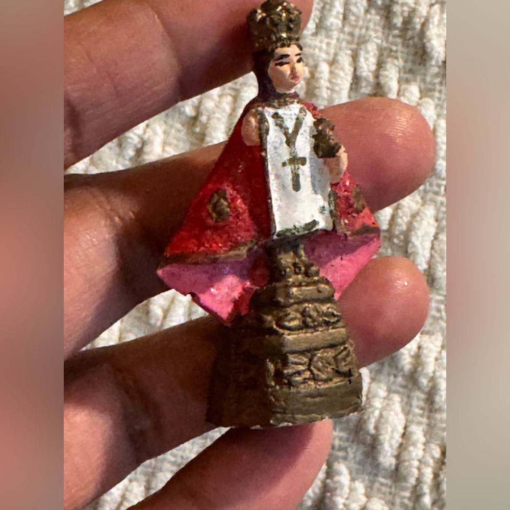 Miniature Religious Figurine with Red Cape